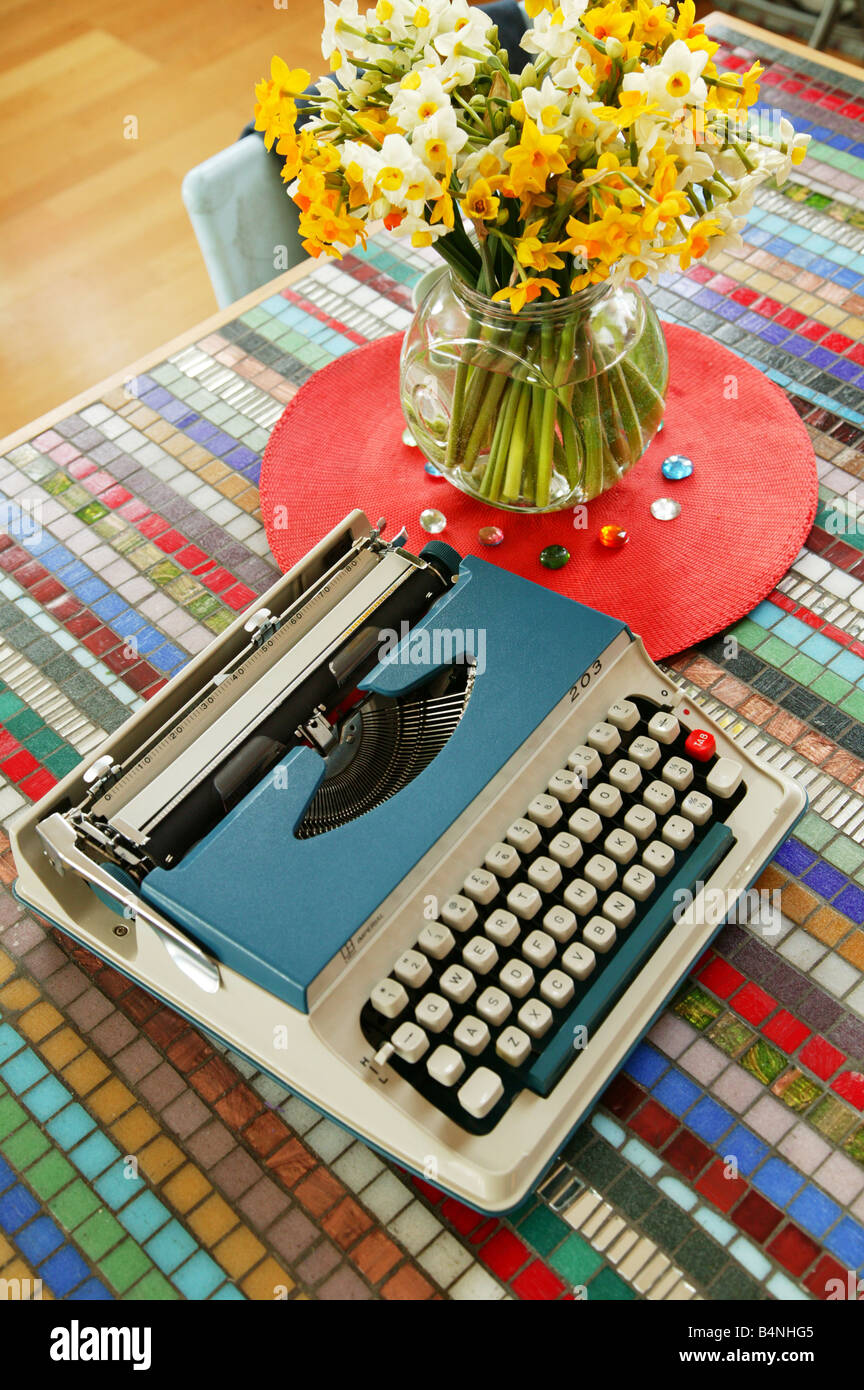 Vintage Blue Typewriter on a table Stock Photo