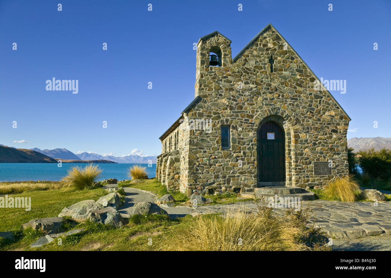 The Church of the Good Shepherd on the banks of Lake Tekapo under a blue sky, South Island, New Zealand Stock Photo