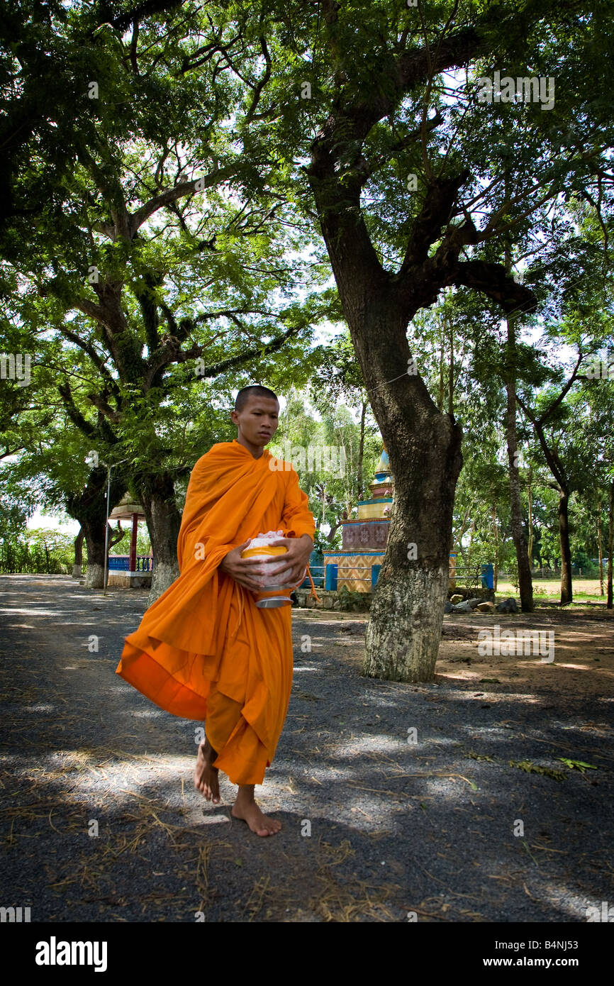 A monk coming back to the temple after morning procession Stock Photo