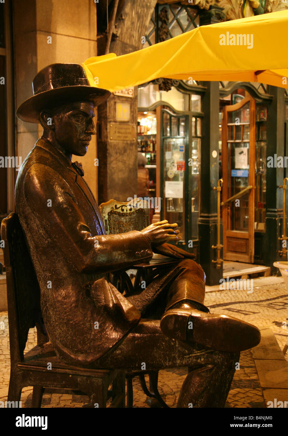 Bronze statue of poet Fernando Pessoa in front of A Brasileira cafe in