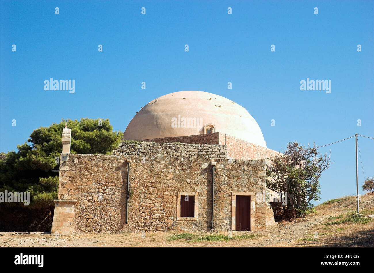 A small fortress chapel and dome of Ibrahim Han Mosque inside of Venetian fortress in Rethymnon Crete Greece September 2008 Stock Photo