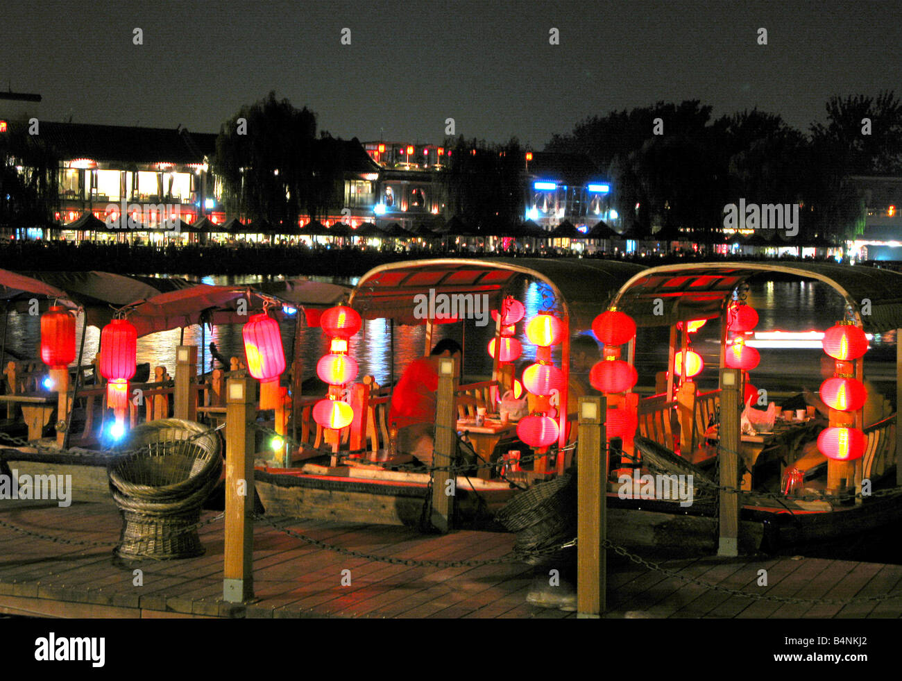 Red lanterns on traditional boats on Lake Qianhai in the Shichahai