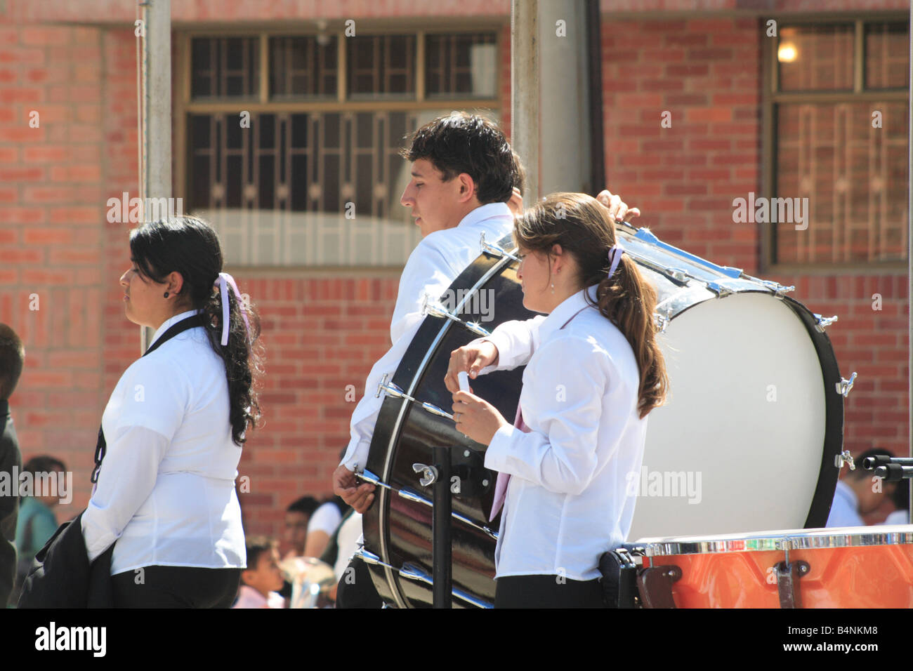 young musicians from a student brass band with a bass drum during a contest. Paipa, Boyacá, Colombia, South America Stock Photo