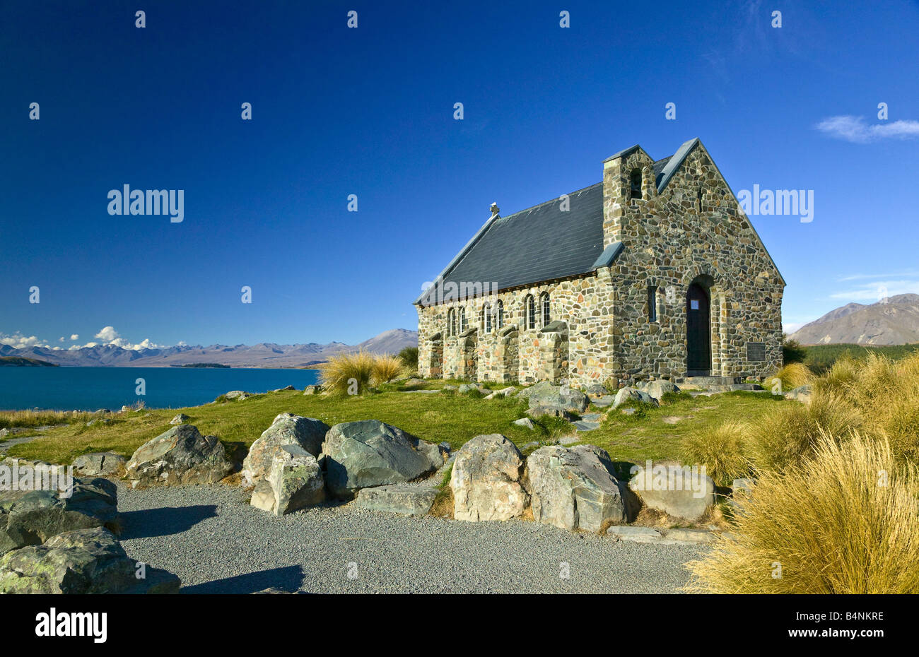 The Church of the Good Shepherd on the shores of Lake Tekapo under a blue sky, South Island, New Zealand Stock Photo