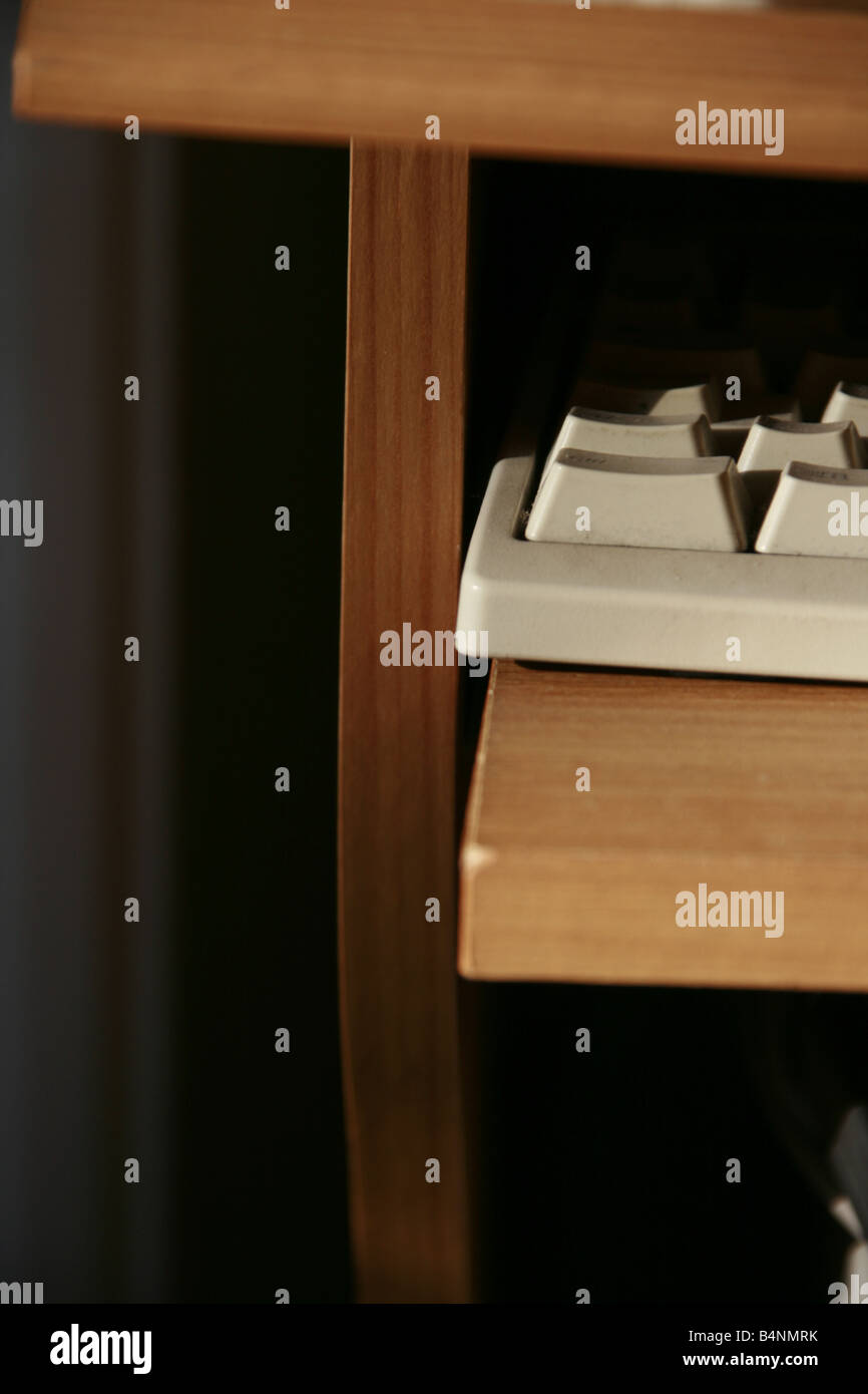 close up detail of pc keyboard on wooden desk Stock Photo - Alamy