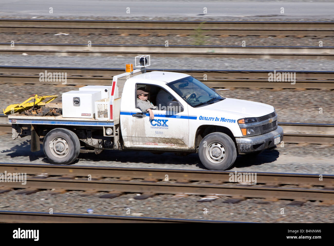A CSX railroad maintenance truck drives along a service road in the Selkirk NY rail yard. Stock Photo