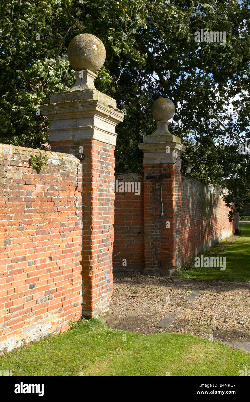 Grand gate posts with big stone balls in a red brick wall Stock Photo ...