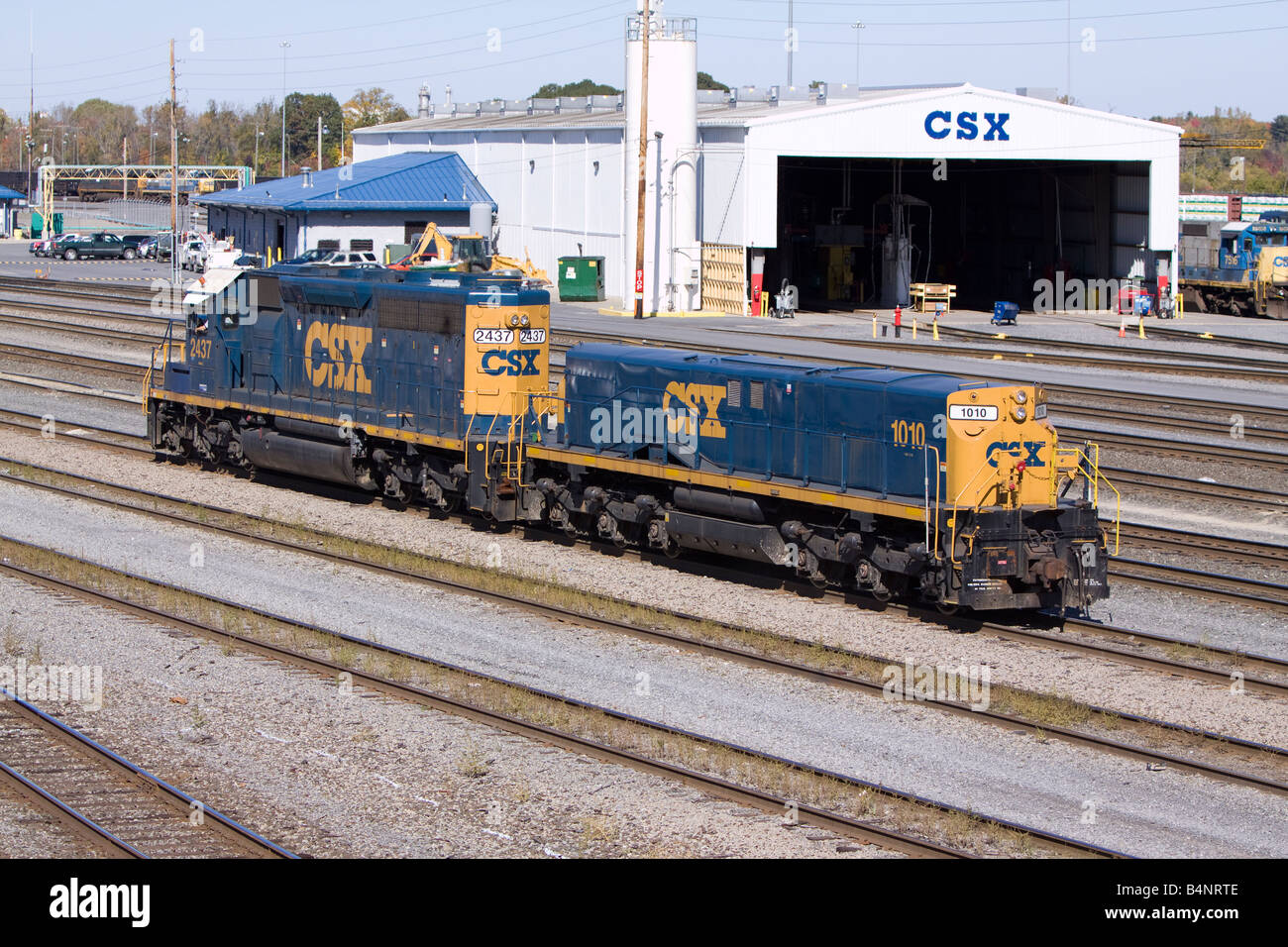 A CSX locomotive and slug (short trailing unit) move through the Selkirk, NY rail yard. Stock Photo