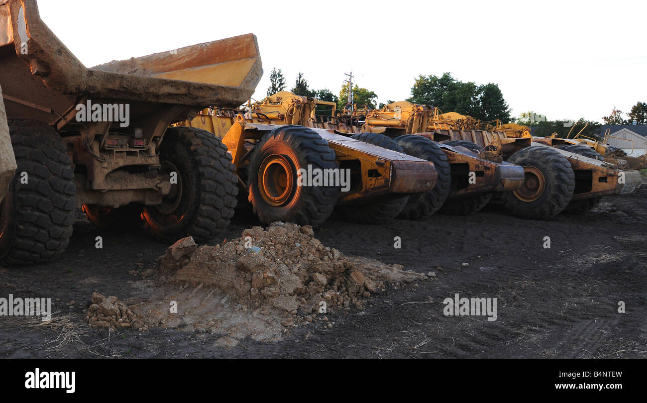 Off road dump trucks at a construction site made by Cat or Caterpillar