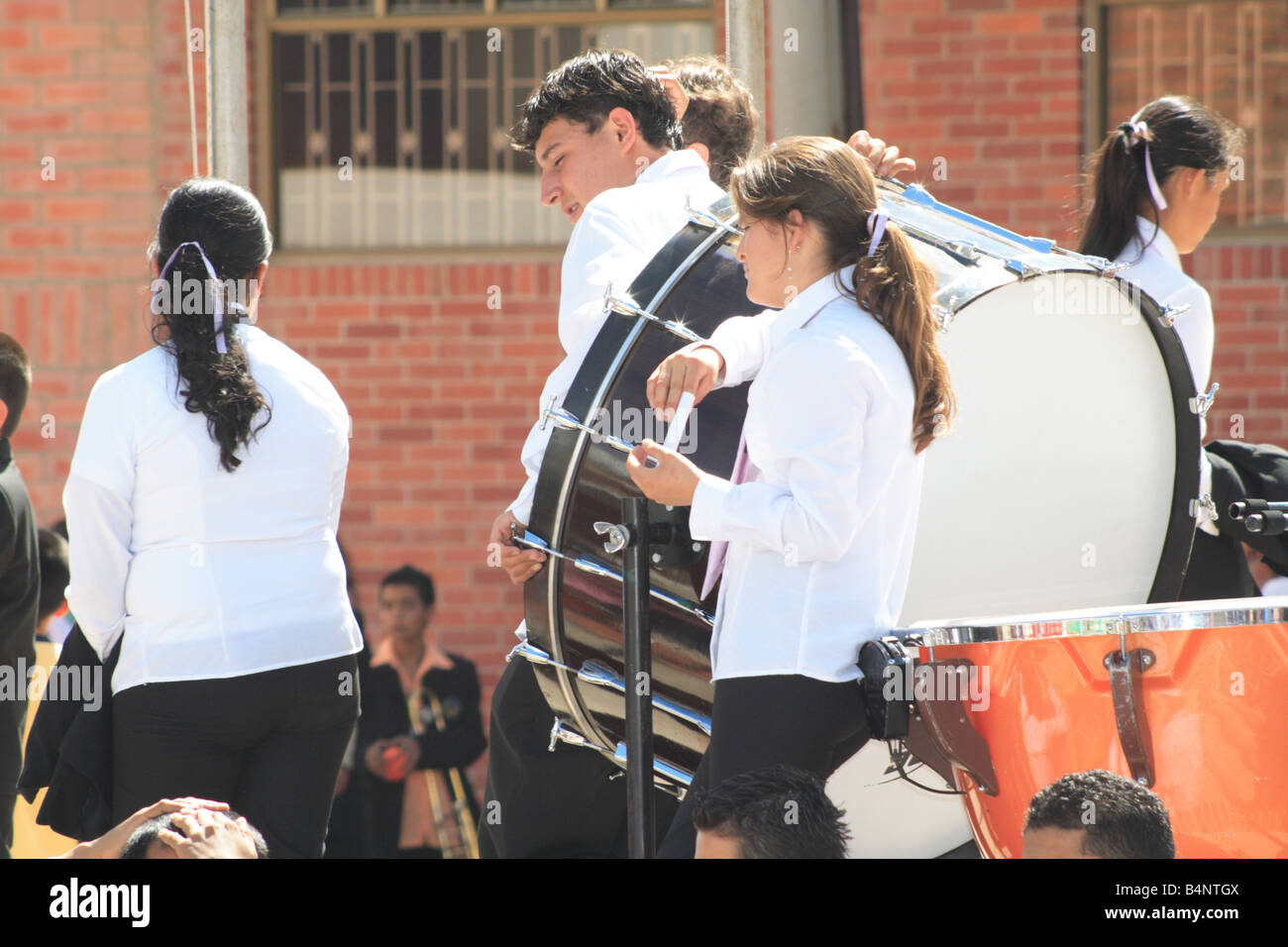 young musicians from a student brass band with a bass drum during a contest. Paipa, Boyacá, Colombia, South America Stock Photo