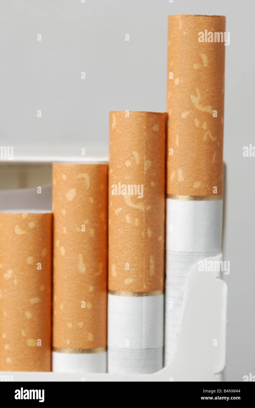 Cigarettes The open pack of cigarettes with the yellow filter Stock Photo