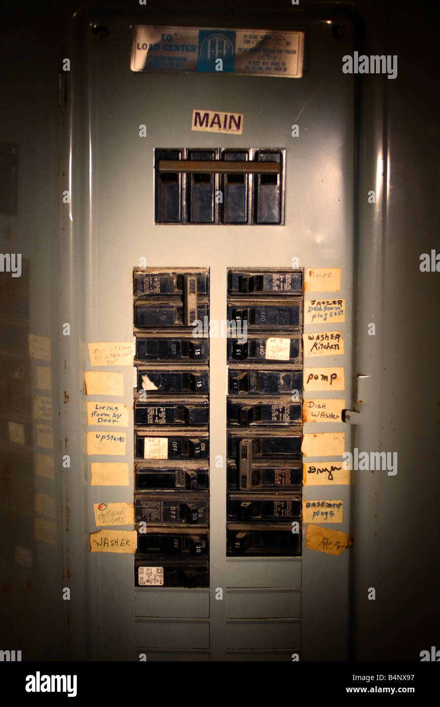 An electrical circuit breaker box is illuminated with a flash light