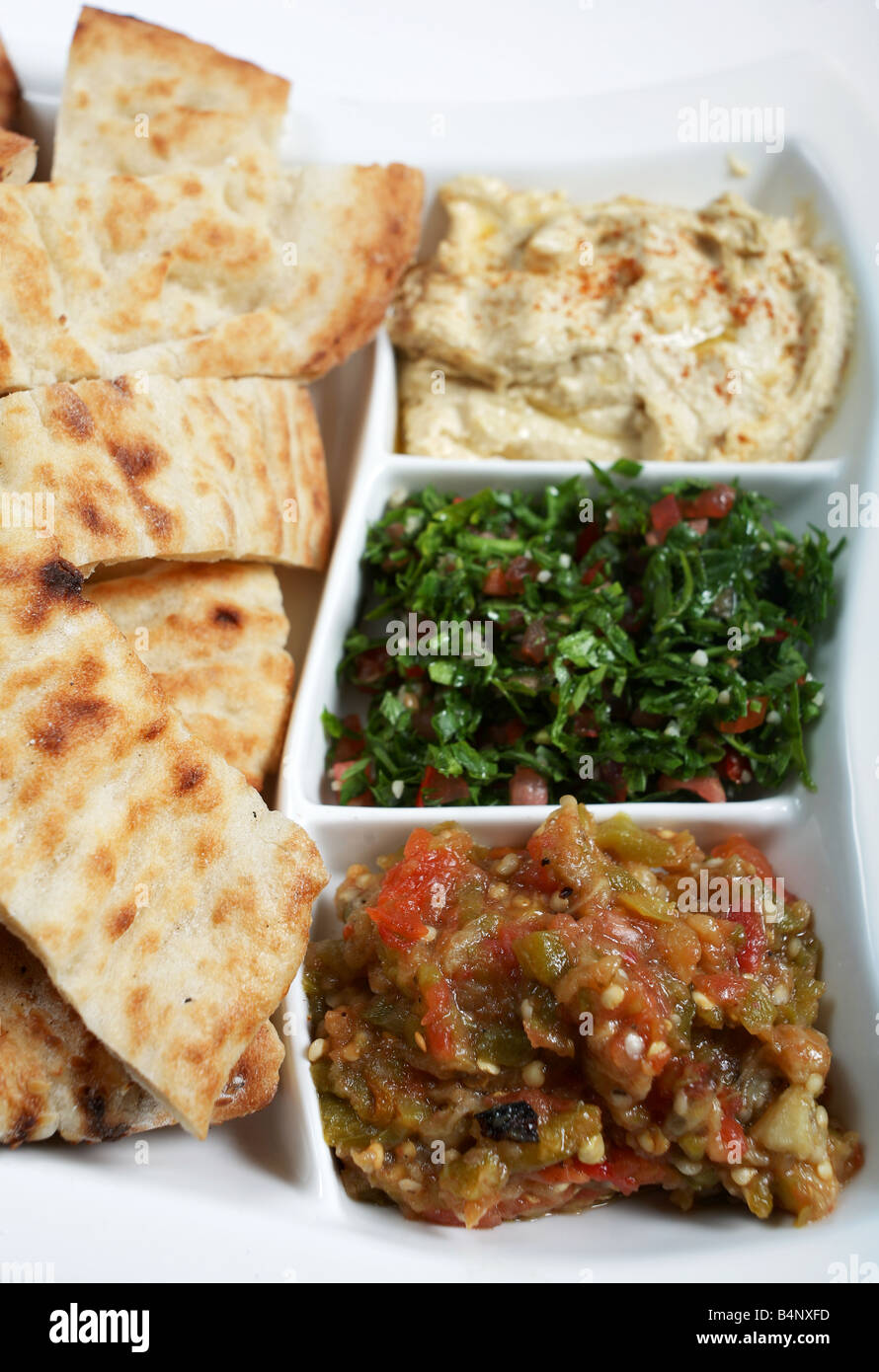 Traditional Arab or Mediterranean mezze with Turkish flat bread From the front babaganoush tabouleh and hummus Stock Photo