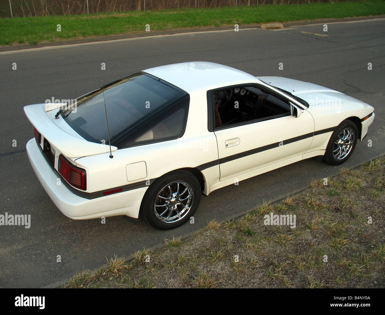 A custom import sports car parked on the side of the road Stock Photo