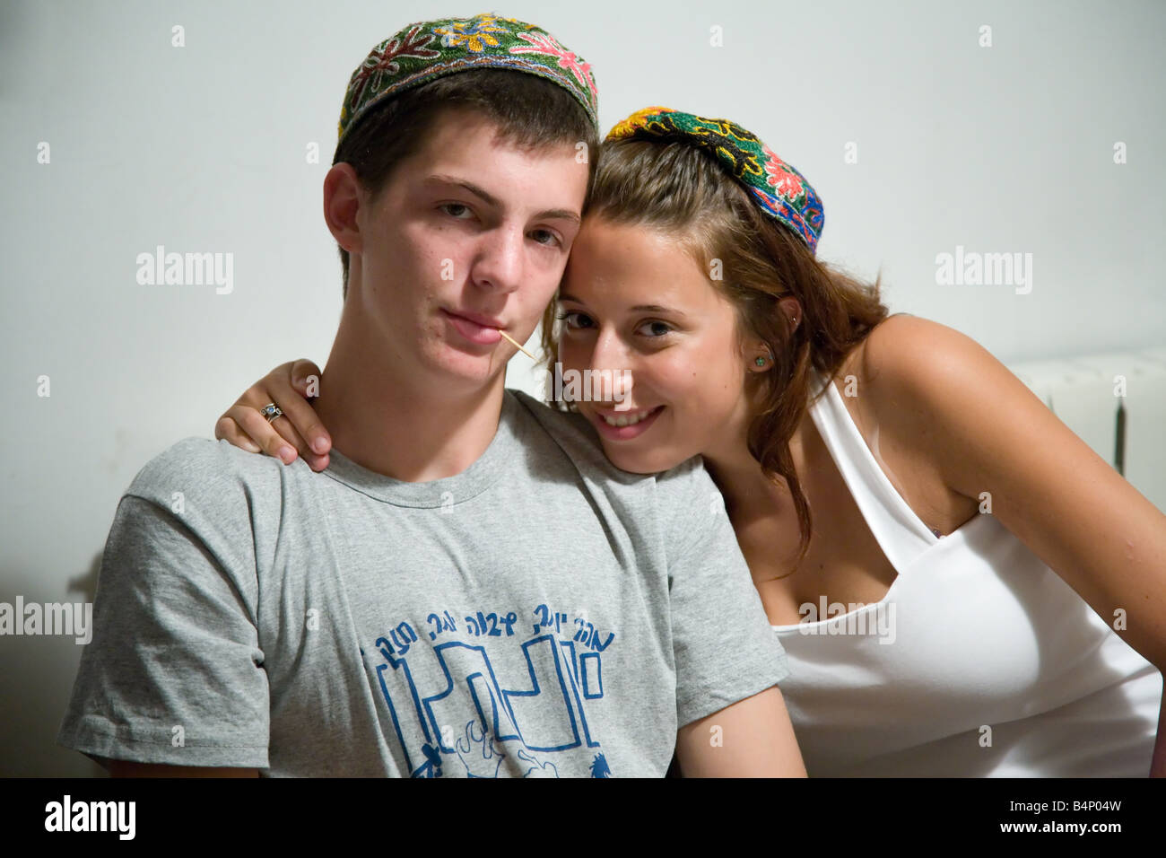 Young Jewish Woman and Man Wearing a Tradition Bukharian Hand Made and Embroided Kippah Stock Photo