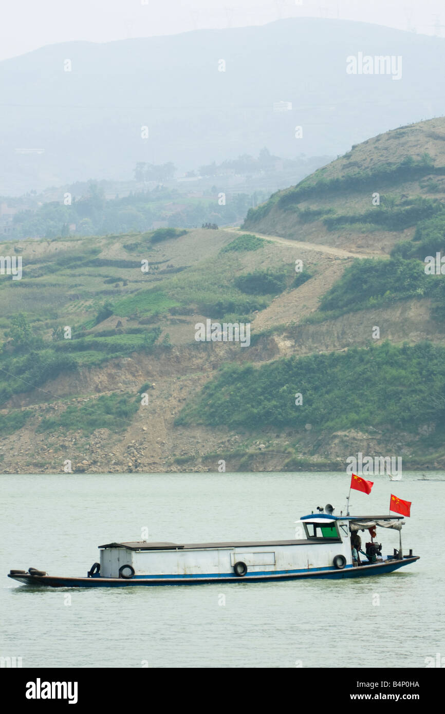A boat on a tributary of the river Yangtze, three gorges,China flies ...