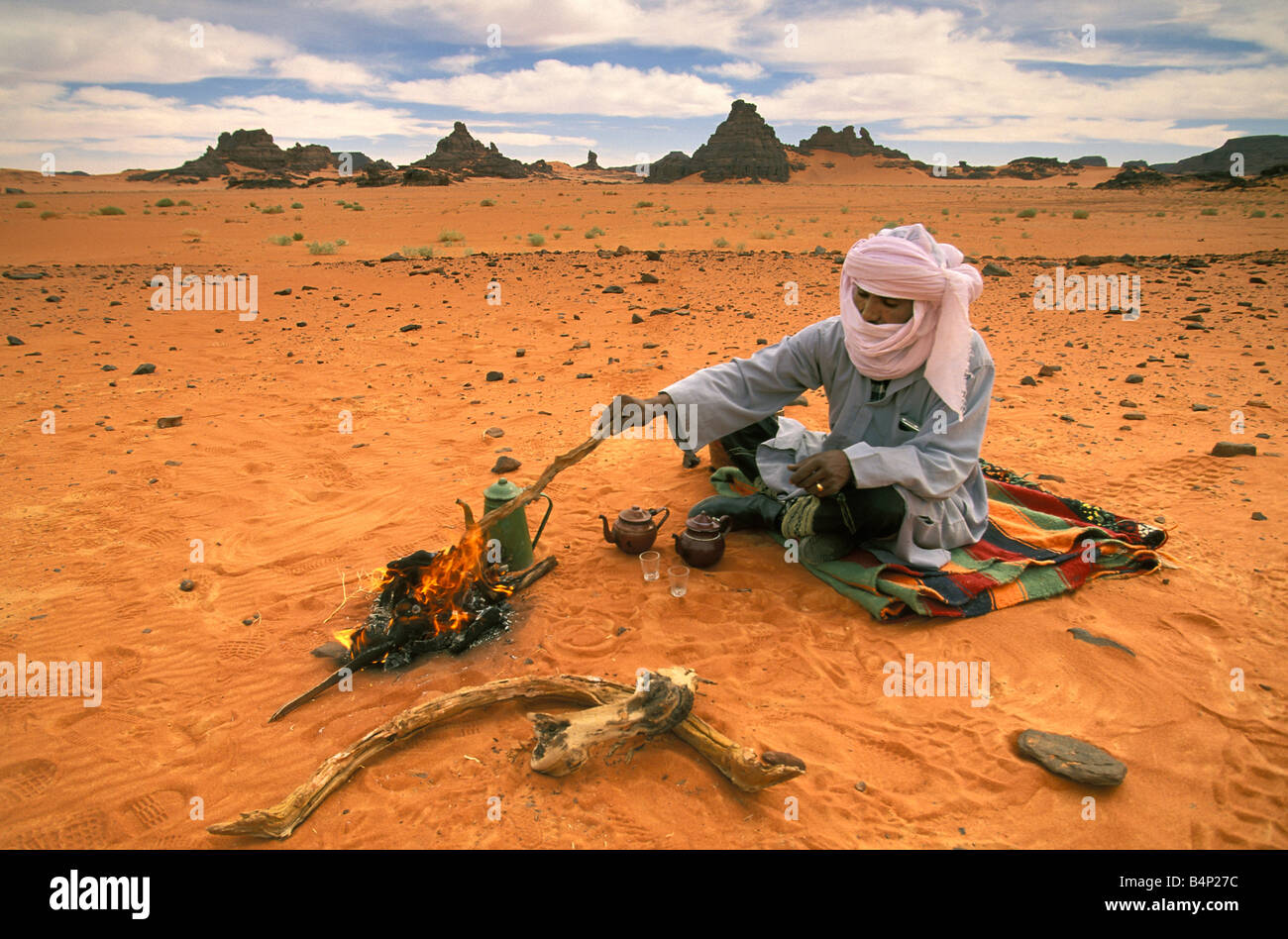 Algeria Man of Tuareg tribe Making tea Sahara Desert Stock Photo