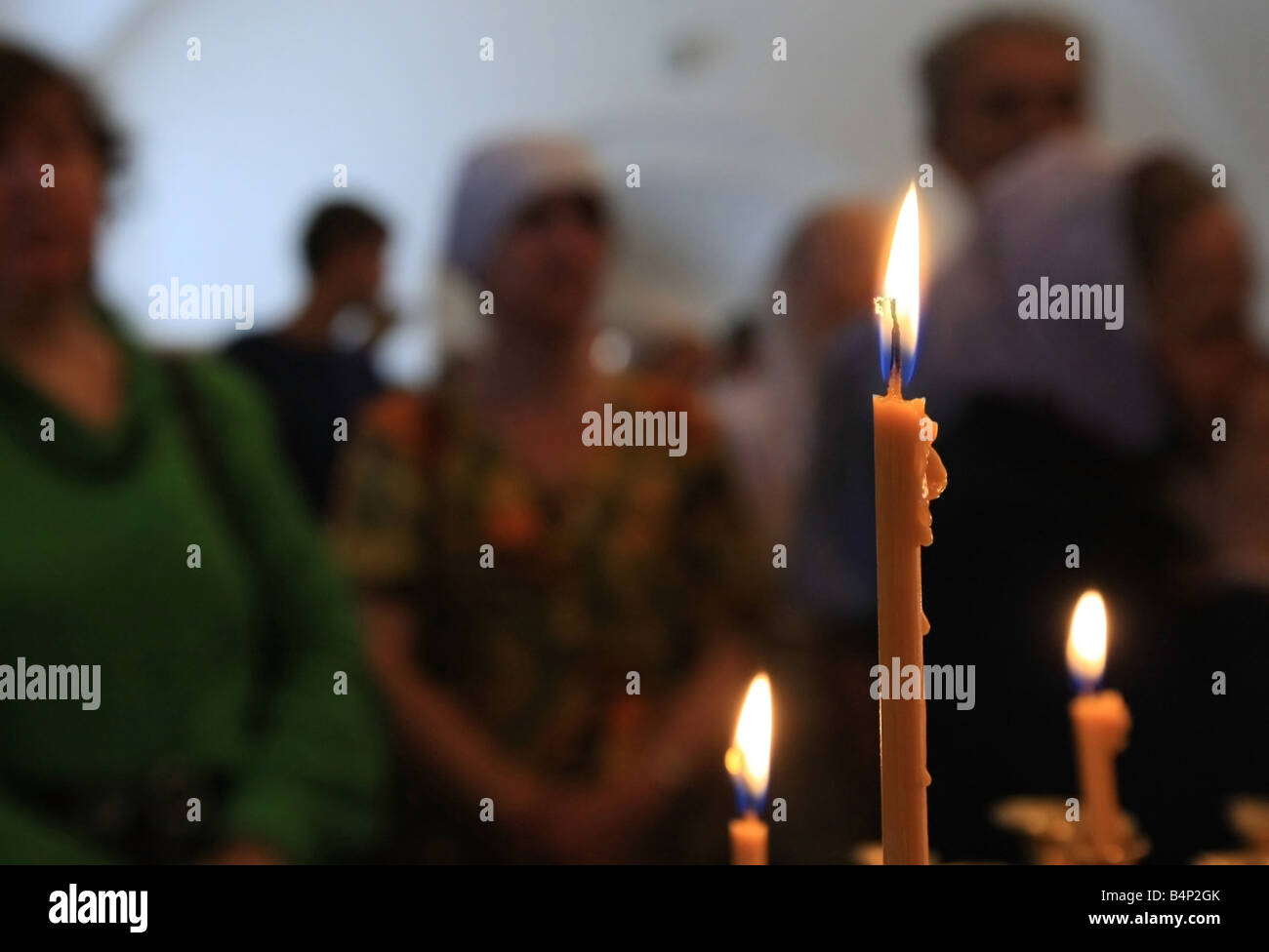 candle lighting in a church Stock Photo Alamy