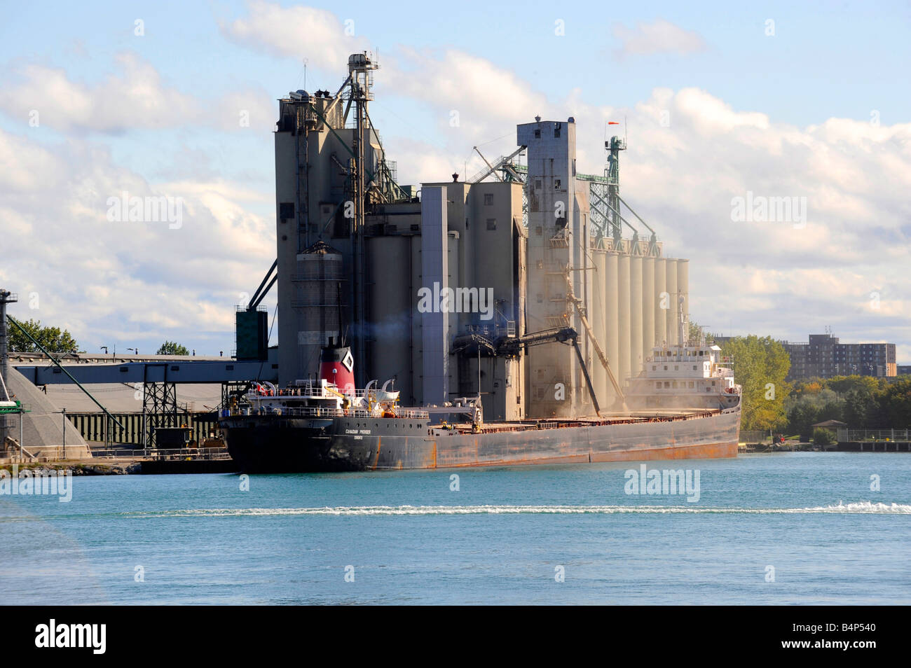 Great Lakes ship onloads agricultural grain on the St Clair River at