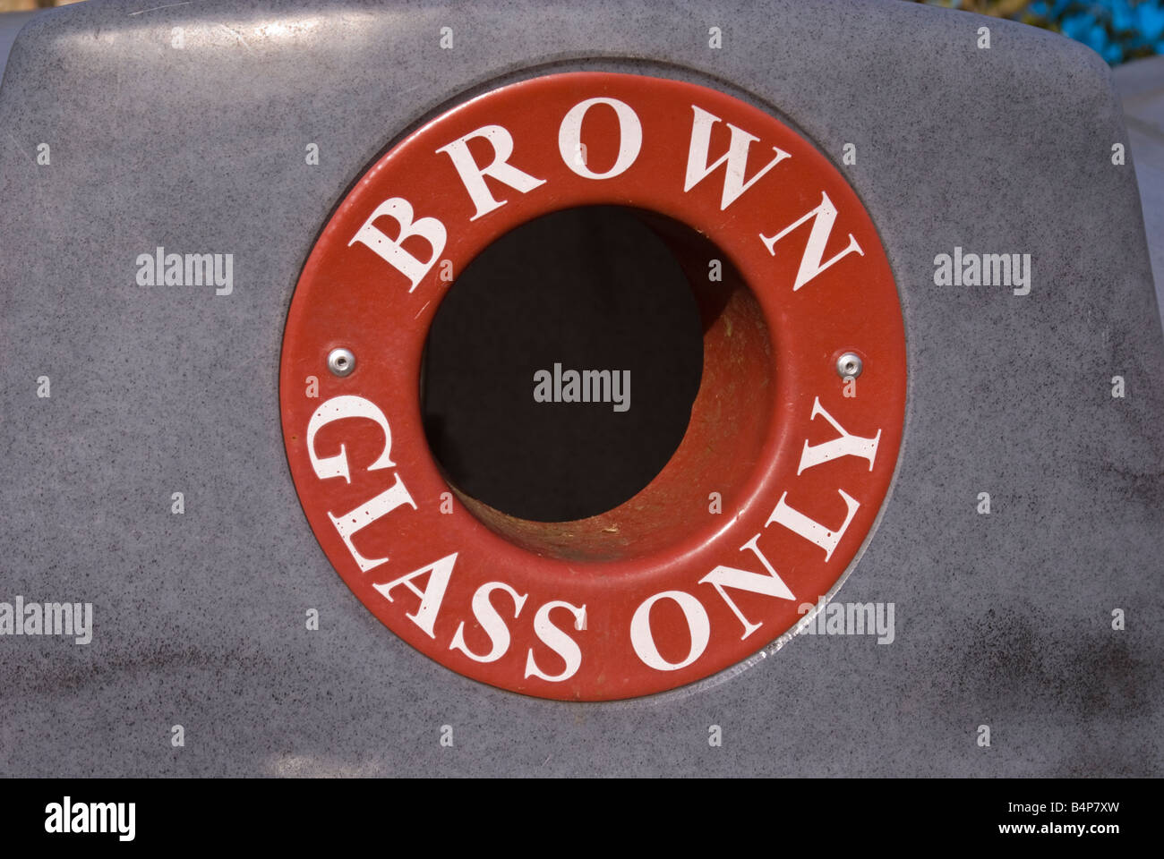 Hole on recycling bin to deposit brown glass only Stock Photo Alamy