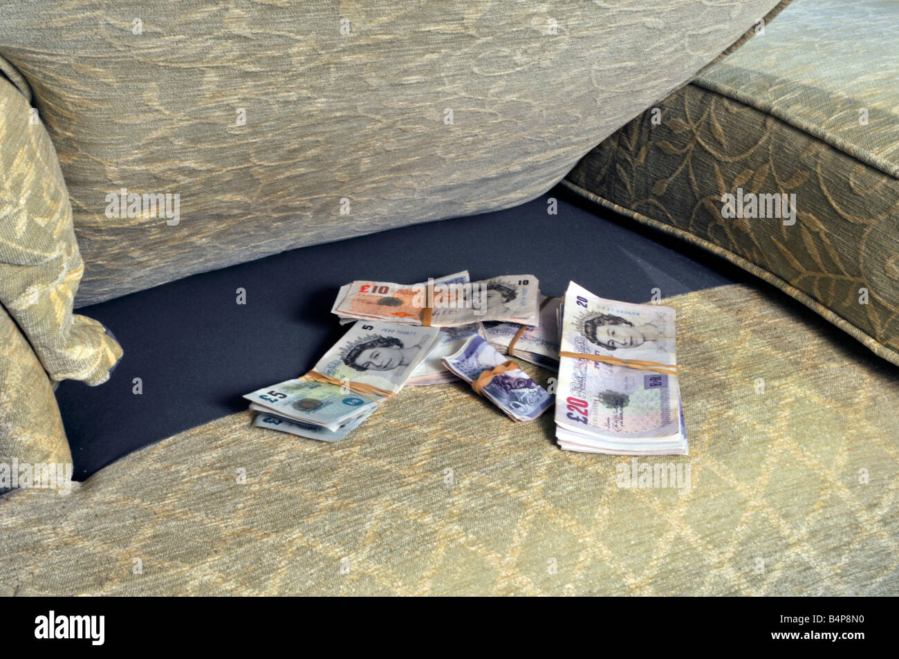 Money savings various values pounds sterling cash bank notes stored in