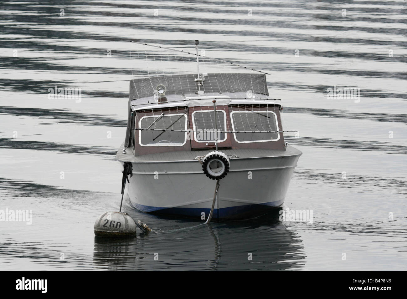 Boat gently rocking on the water at Lake Maggiore, Italy Stock Photo