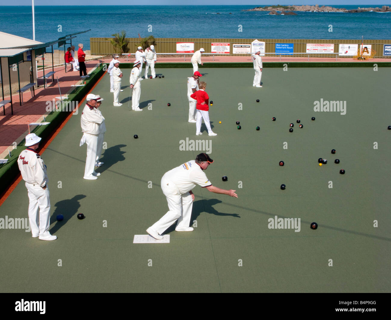 Bowlers dressed in white playing lawn bowls by the sea at Port Elliot in South Australia near Adelaide 2008 Stock Photo