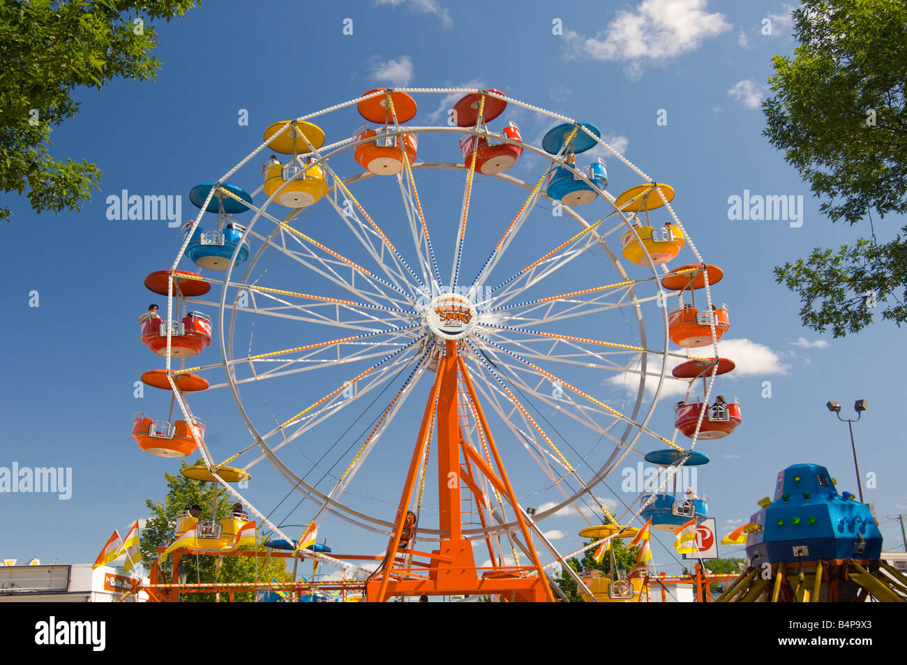 A colorful midway with ferriswheel at the Corn and Apple Festival in