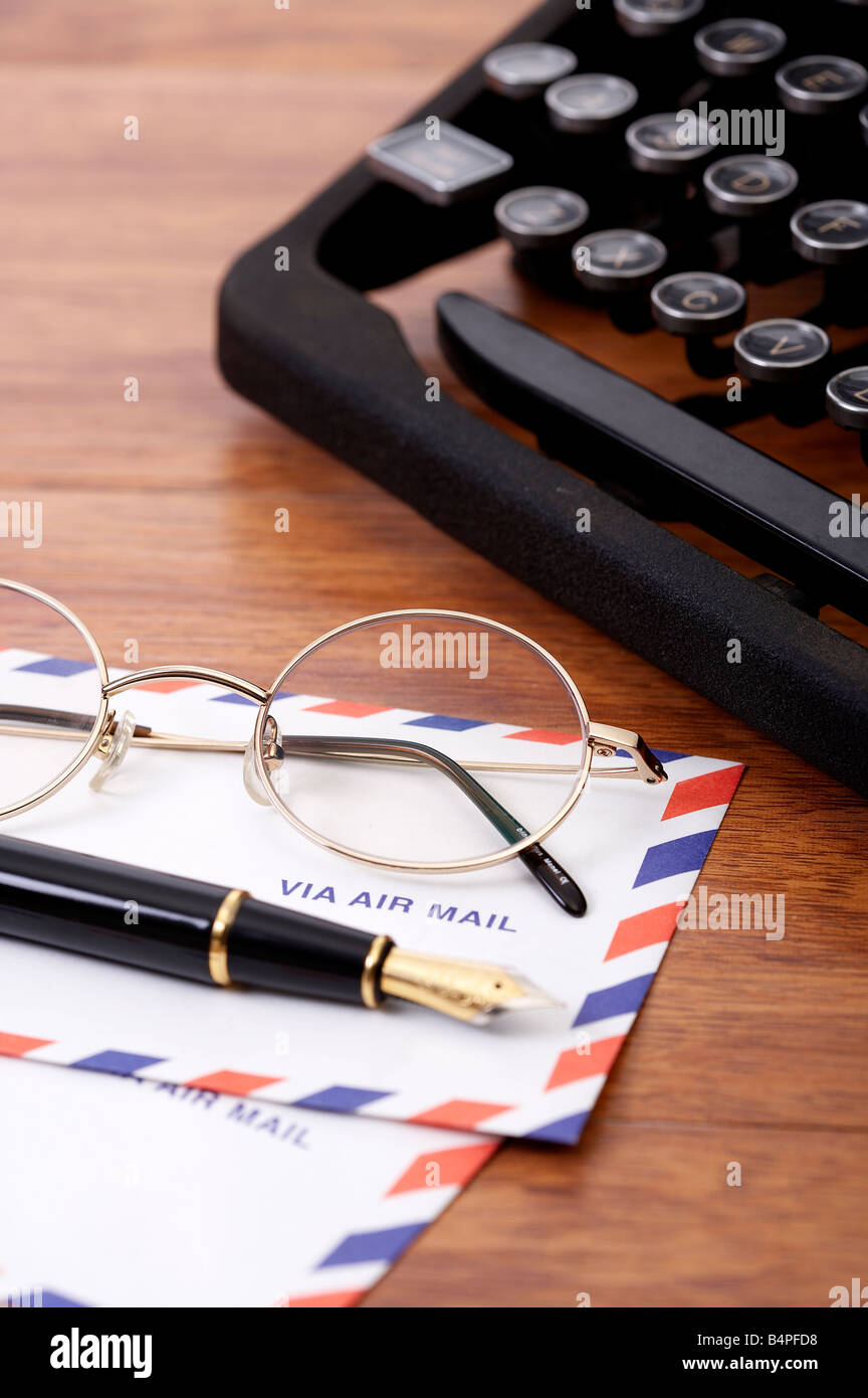 Typewriter by eyeglasses and fountain pen, close-up Stock Photo