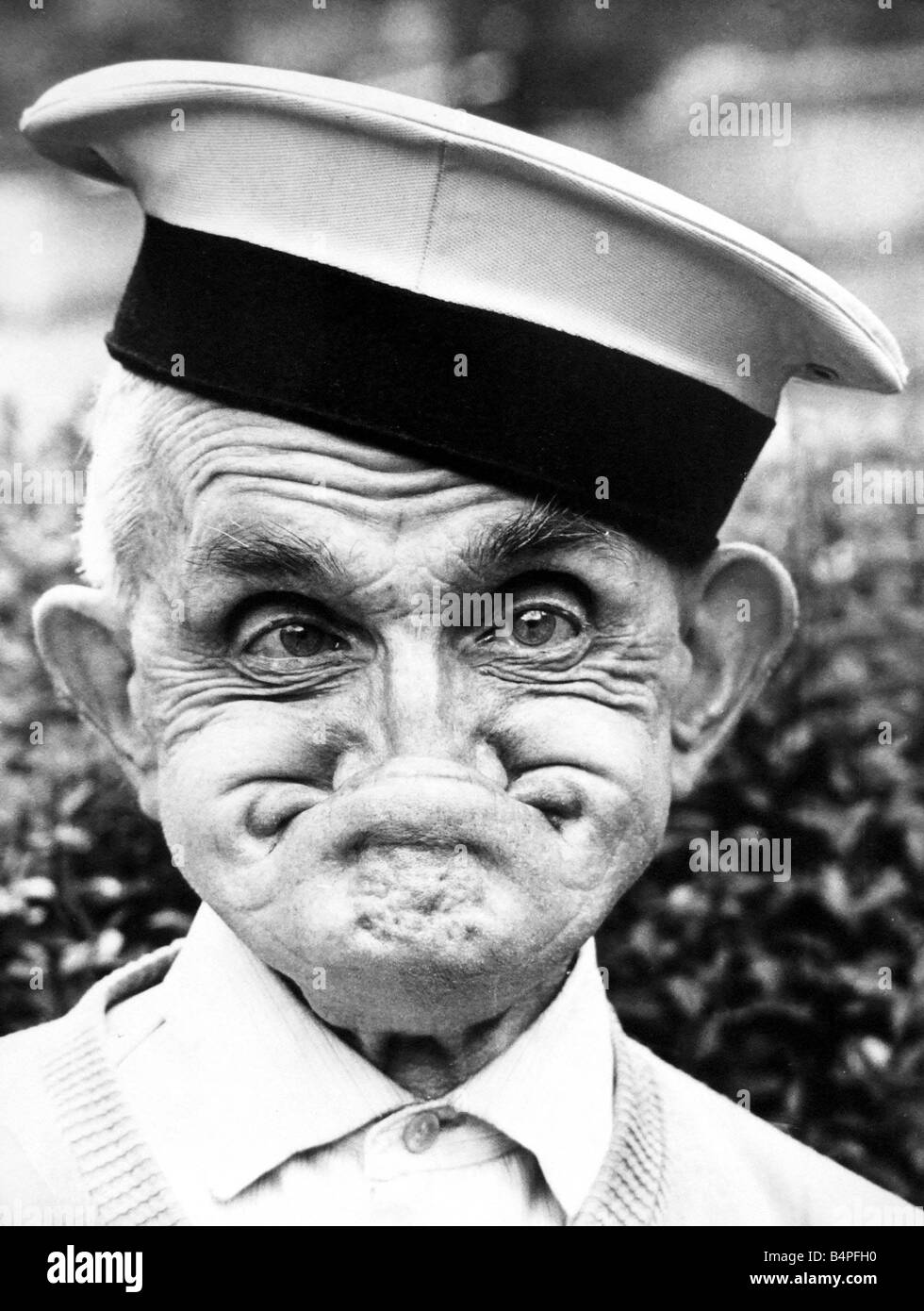 One of the faces of champion gurner Dai Llewellyn of Mountain Ash now aged 82 but gurning as well as ever August Stock Photo
