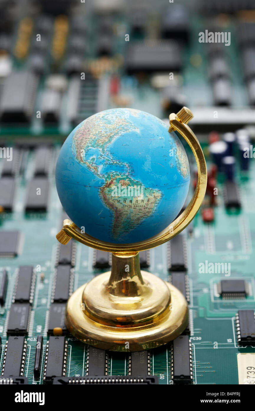 Globe On Green Circuit Board Close Up Stock Photo Alamy