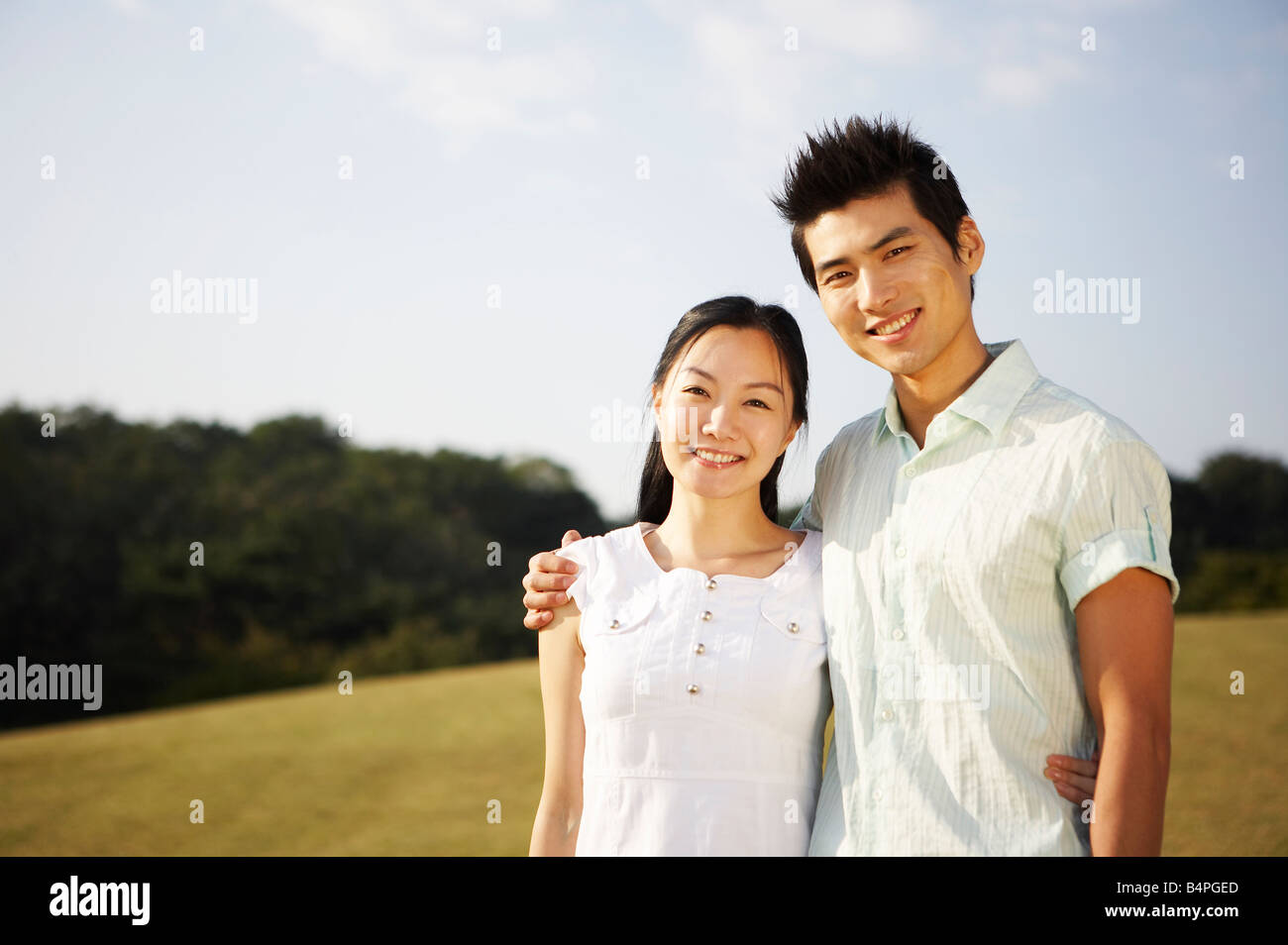 Young couple smiling Stock Photo - Alamy