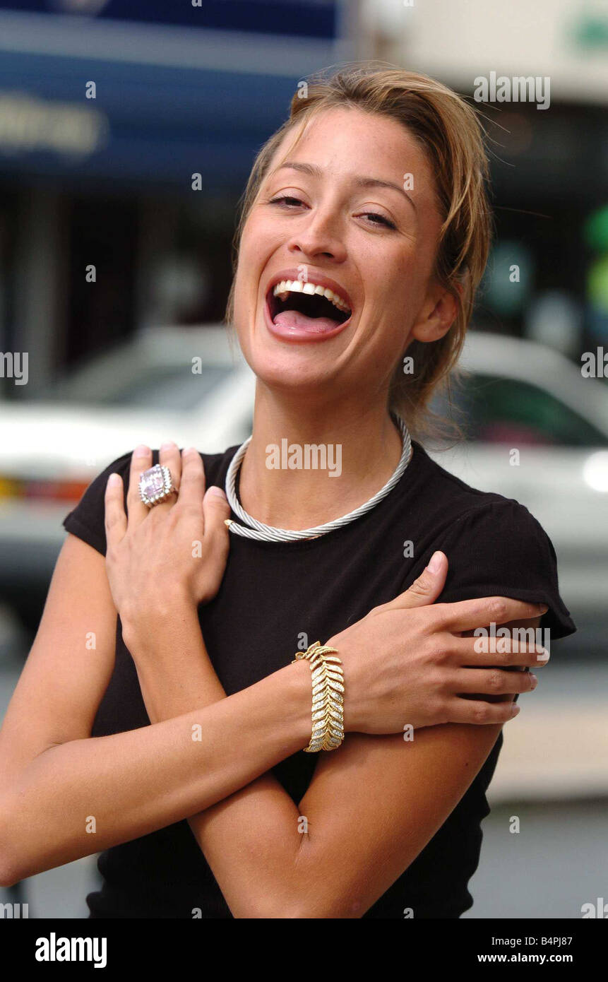 Rebecca Loos 26 launches a new range of jewellery from Kim Rose in Southampton Rebecca is wearing a 6000 tanzanite ring plus a 3500 diamond bracelet and 1600 necklace standing with her arms crossed over her chest laughing Stock Photo