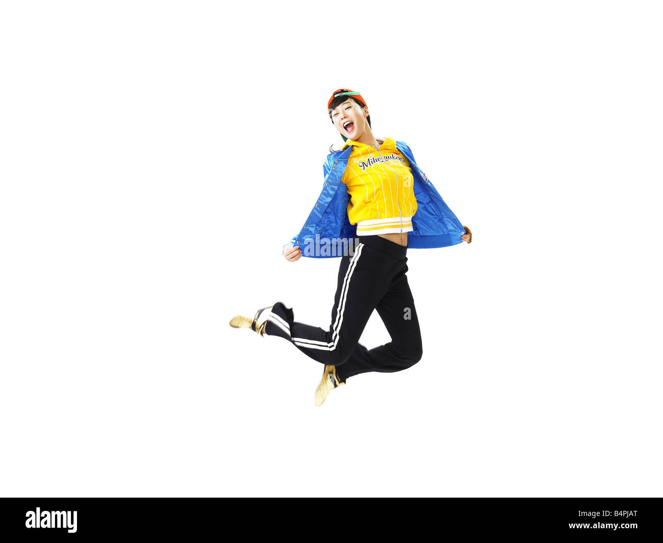 Young woman jumping against white background Stock Photo - Alamy