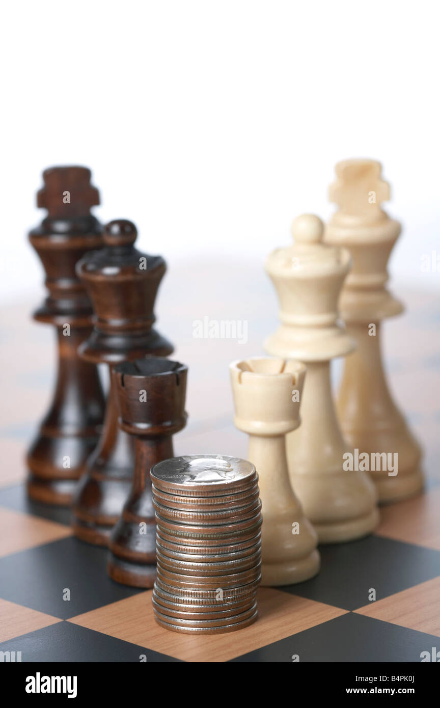 Close up of a chessboard with coins Stock Photo - Alamy