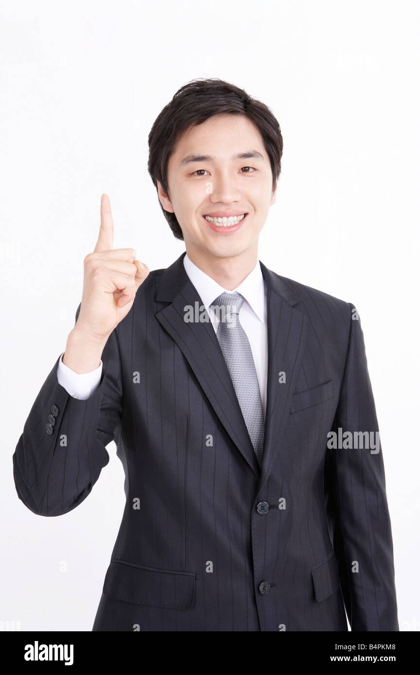 Portrait of a businessman smiling with arms raised Stock Photo - Alamy