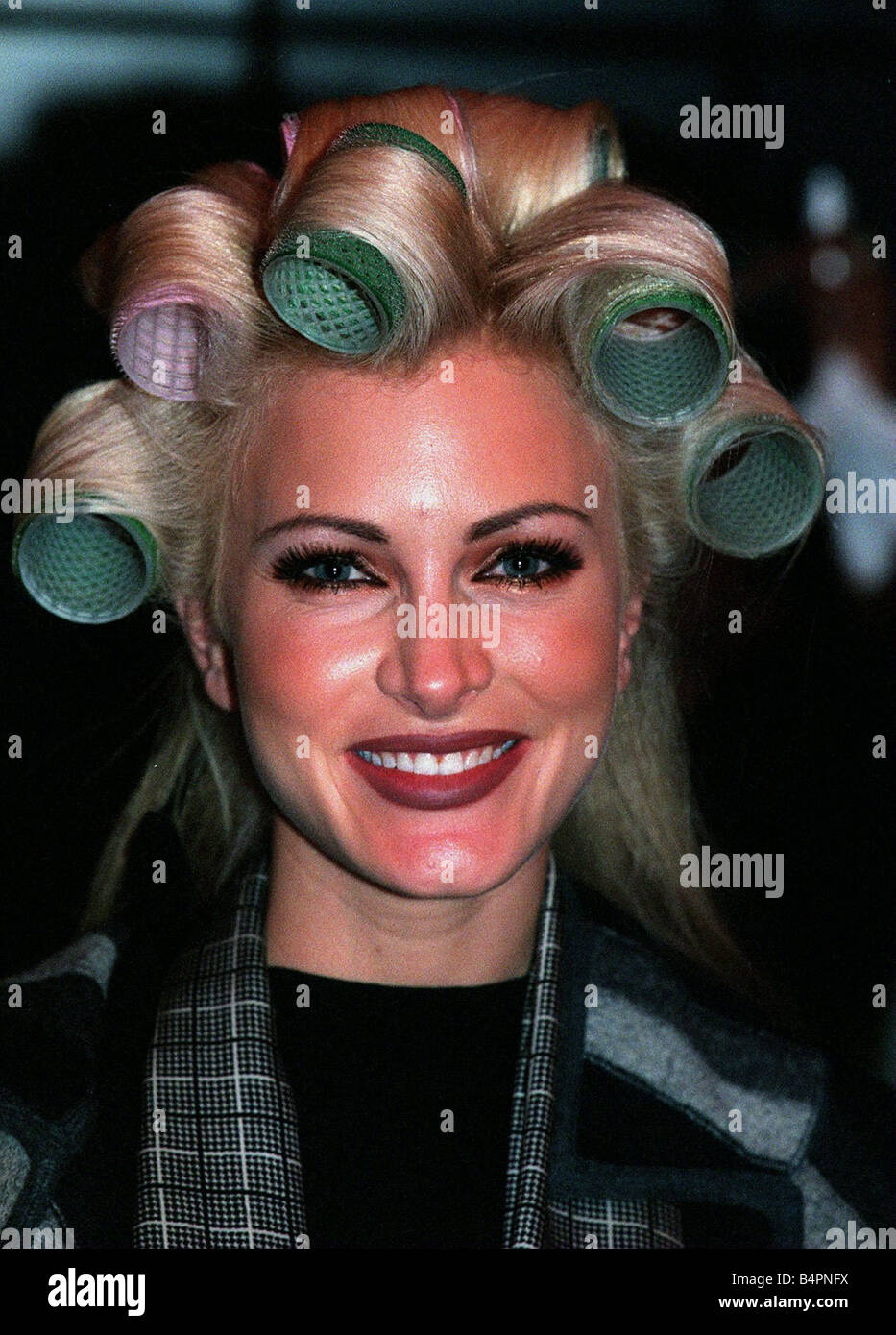 Caprice having her hair and make up done at the Littlewoods Fashion Show With rollers in her hair circa 1997 Stock Photo