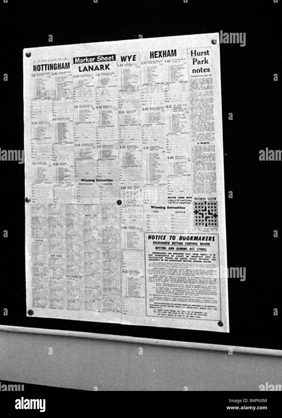 The form guide pinned to a notice board inside Peter Massie betting shop in Bethnal Green London May 1961 Stock Photo