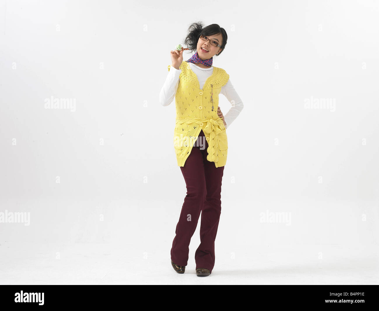 Portrait of a young woman against white background Stock Photo - Alamy