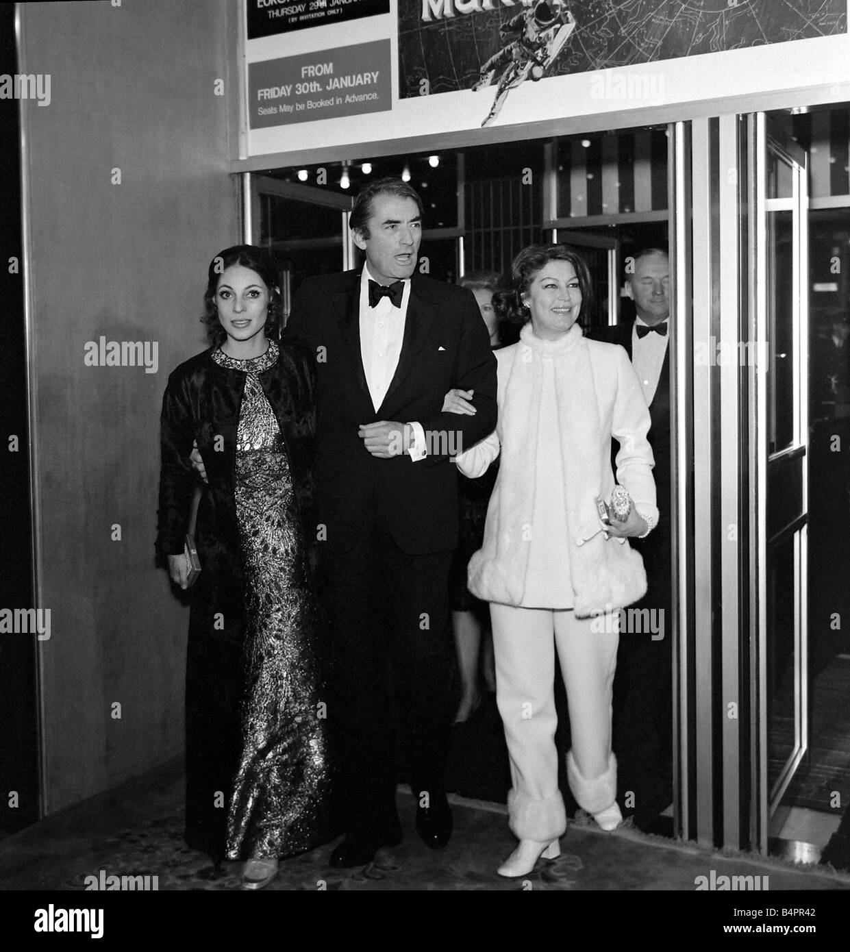 Ava Gardner with Gregory Peck and his wife January 1970 Arriving at the theatre for the Gala European Premiere of Marooned at the Odeon in Leicester Square London Stock Photo