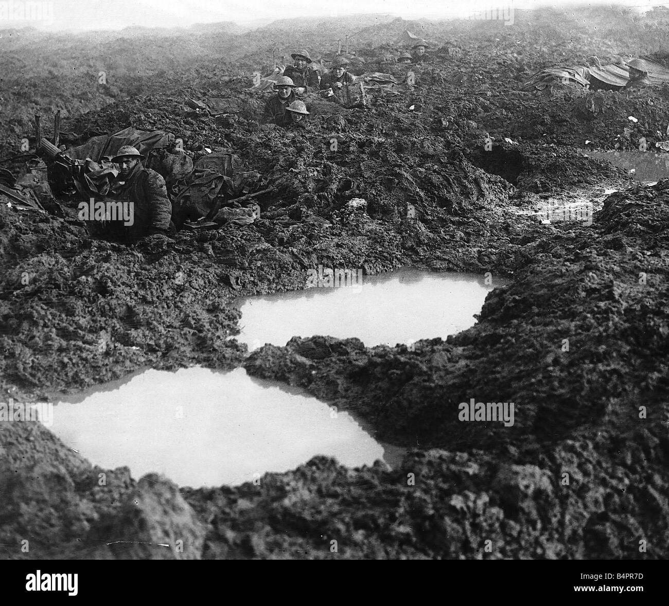 Canadians soldiers holding the line at Passchendale 1918 during World War One There are no trenches just mud filled bomb craters Stock Photo