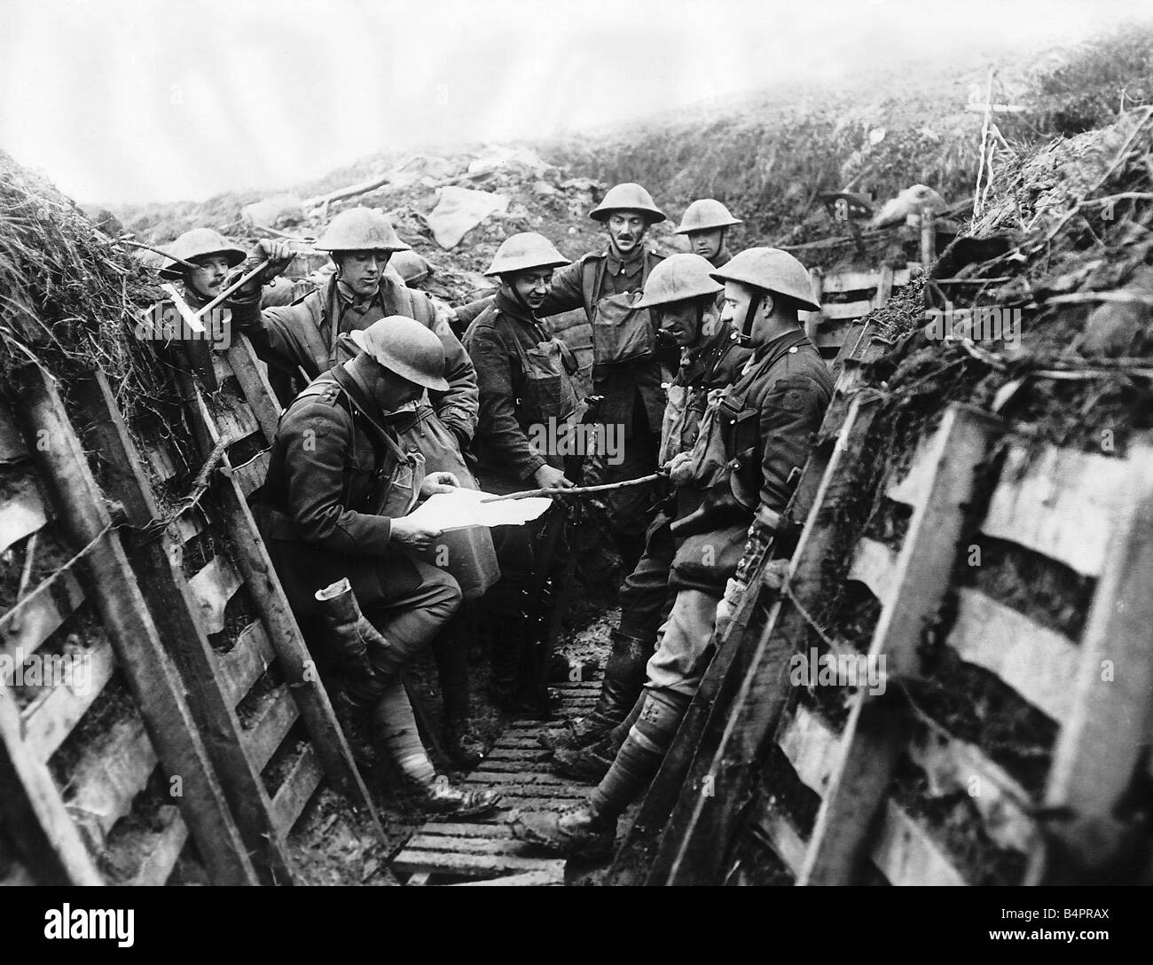 Soldiers from the Kings Liverpool Regiment listening to the news being