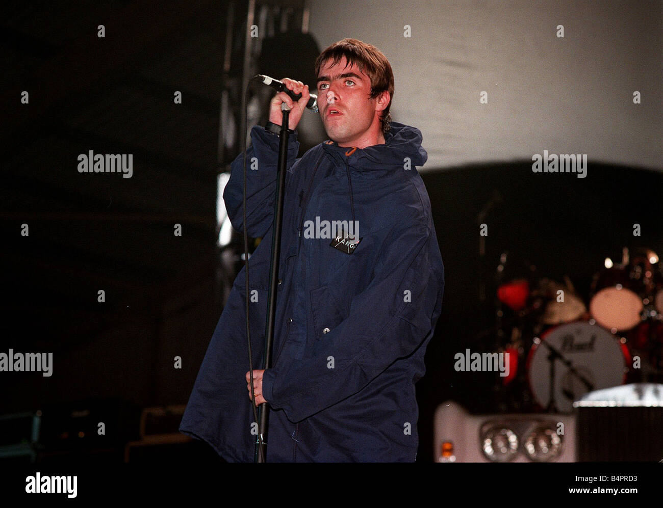 Liam Gallagher of the pop group Oasis on stage Sept 1997 Stock Photo ...