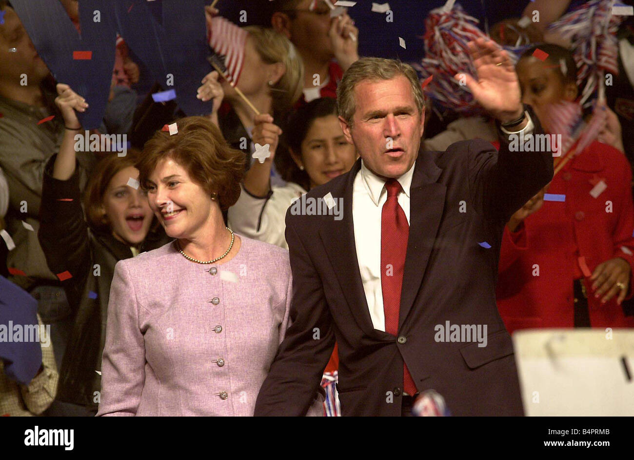 George W Bush November 2000 Texas Governor receives stars and stripes ticker tape style welcome home with wife Laura Bush in Austin Texas as campaigning is over and the waiting begins Stock Photo