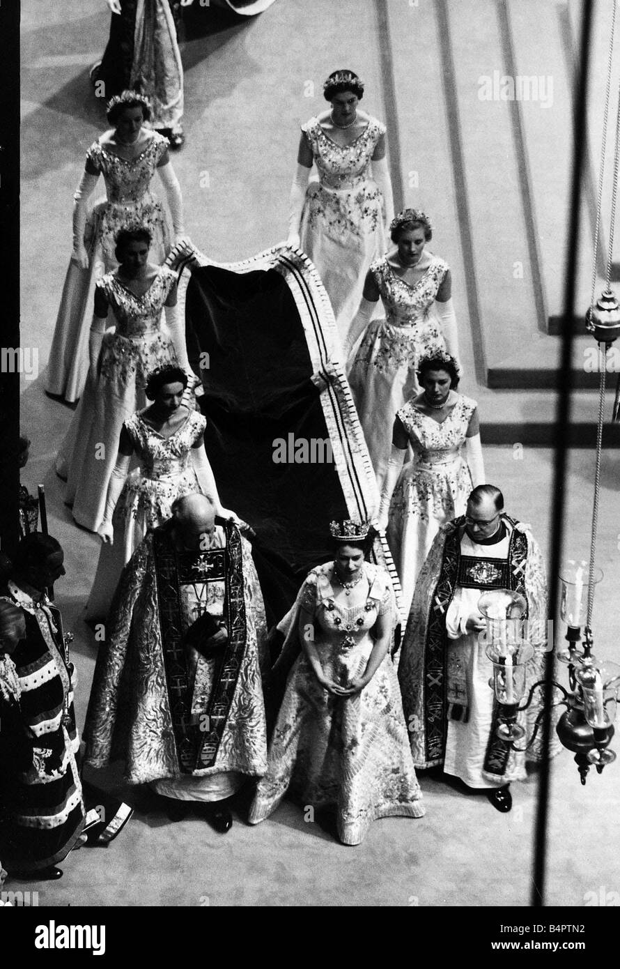 Queen Elizabeth II Coronation Westminster Abbey June 1953 walking down the aisle train carried by women Stock Photo
