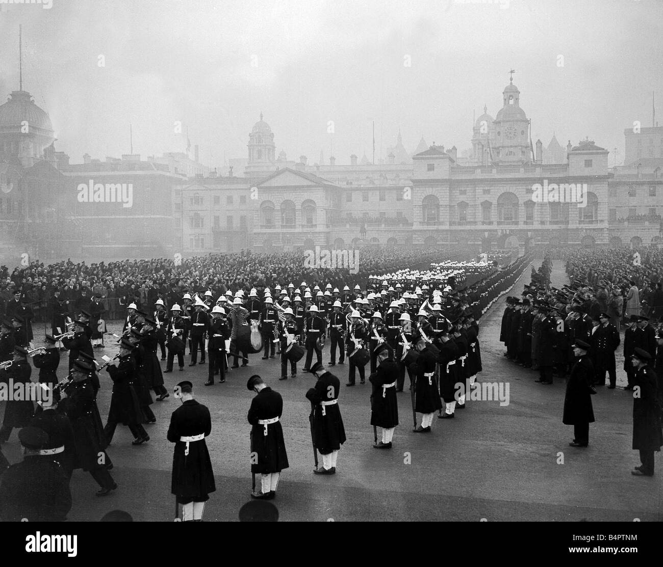 King George VI Death State Funeral February 1952 The gun carriage with the coffin of King George is pulled through the streets of London by sailors of the Royal Navy and flanked by soldiers of the Guards Stock Photo