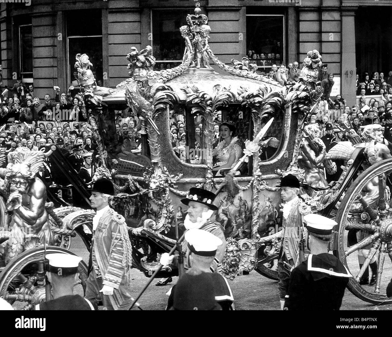 Queen Elizabeth Coronation June 1953 accompanied the smiles from the coach as the procession passed King Charles Statue accompanied by the Duke of Edinburgh on her way to Westminster Abbey Stock Photo