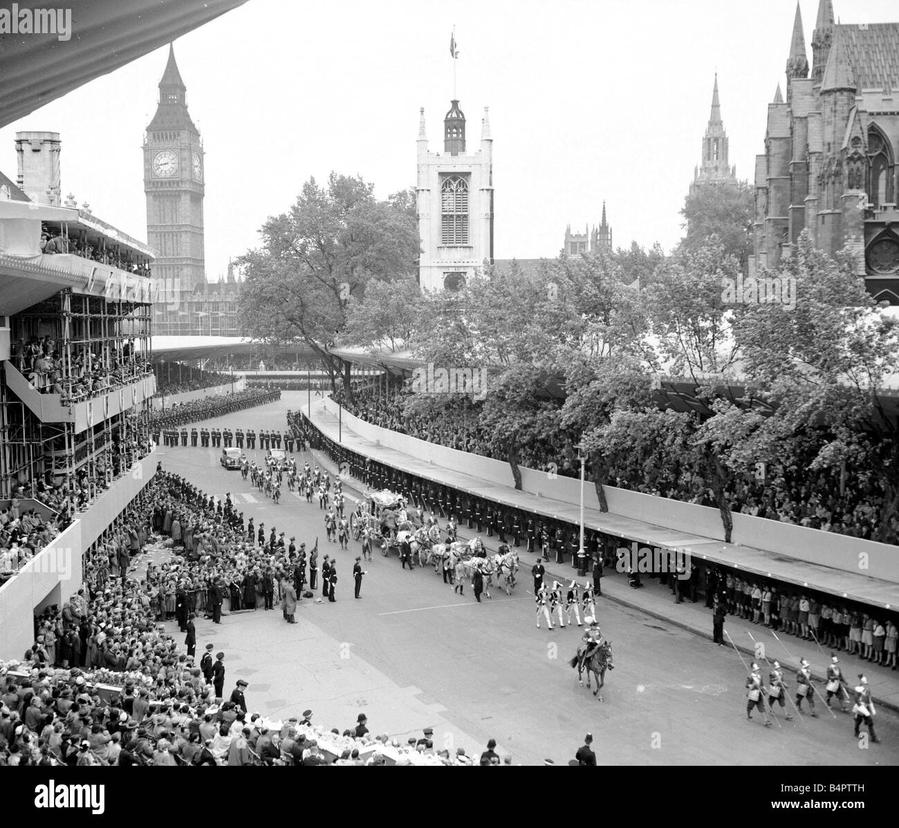 Queen Elizabeth II Coronation June 1953 The Queen s coronation procession nears Westminster Abbey in its journey from Buckingham Palace The Queen was carried through the streets of the capital in a majestic golden coach pulled by eight beautiful grey horses Heads of state foreign royalty and the leaders of every Commonwealth nation took part in the procession carried in their official coaches to the Abbey Stock Photo