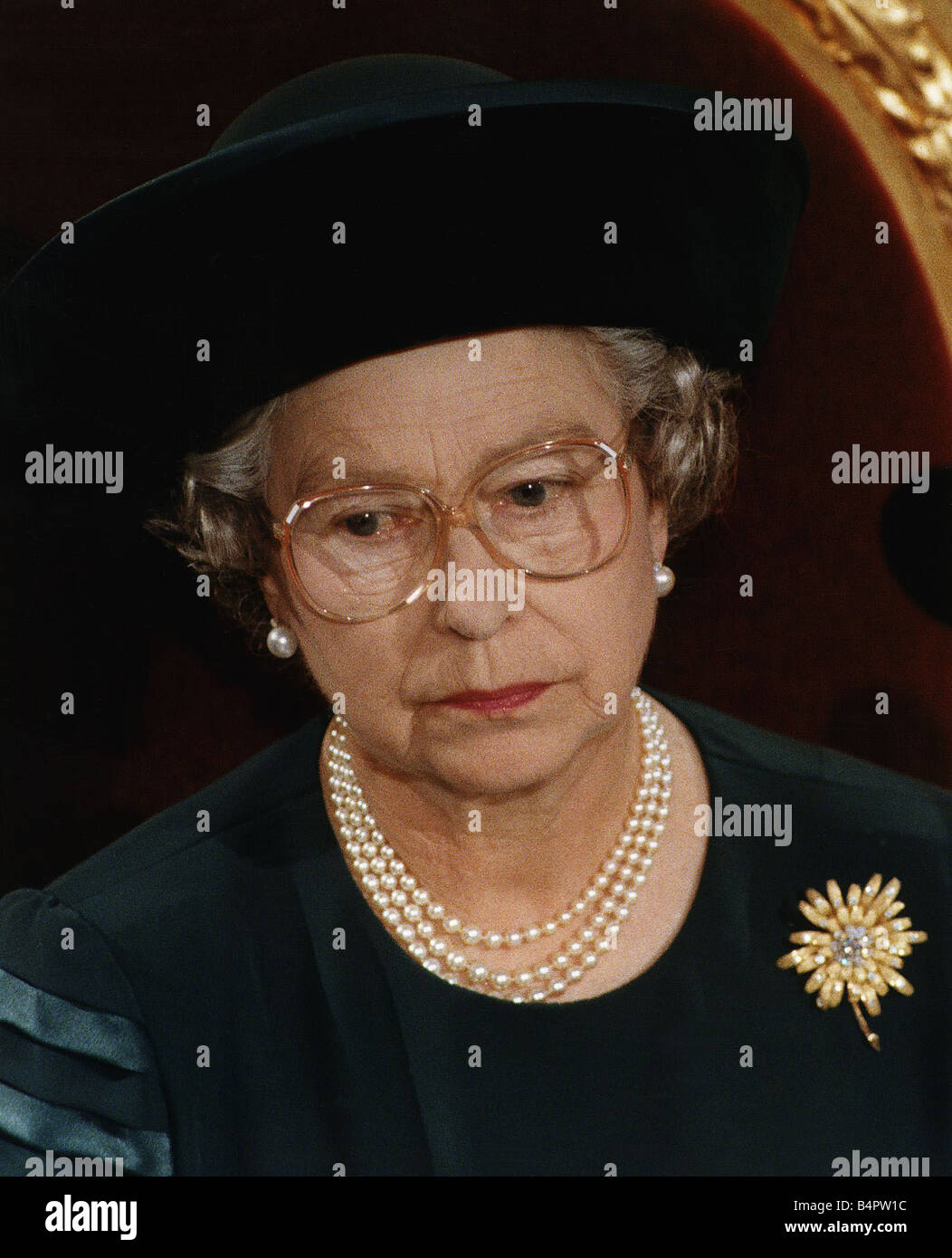 Queen Elizabeth wearing glasses Recent family problems took their toll on  Her Highness Stock Photo - Alamy