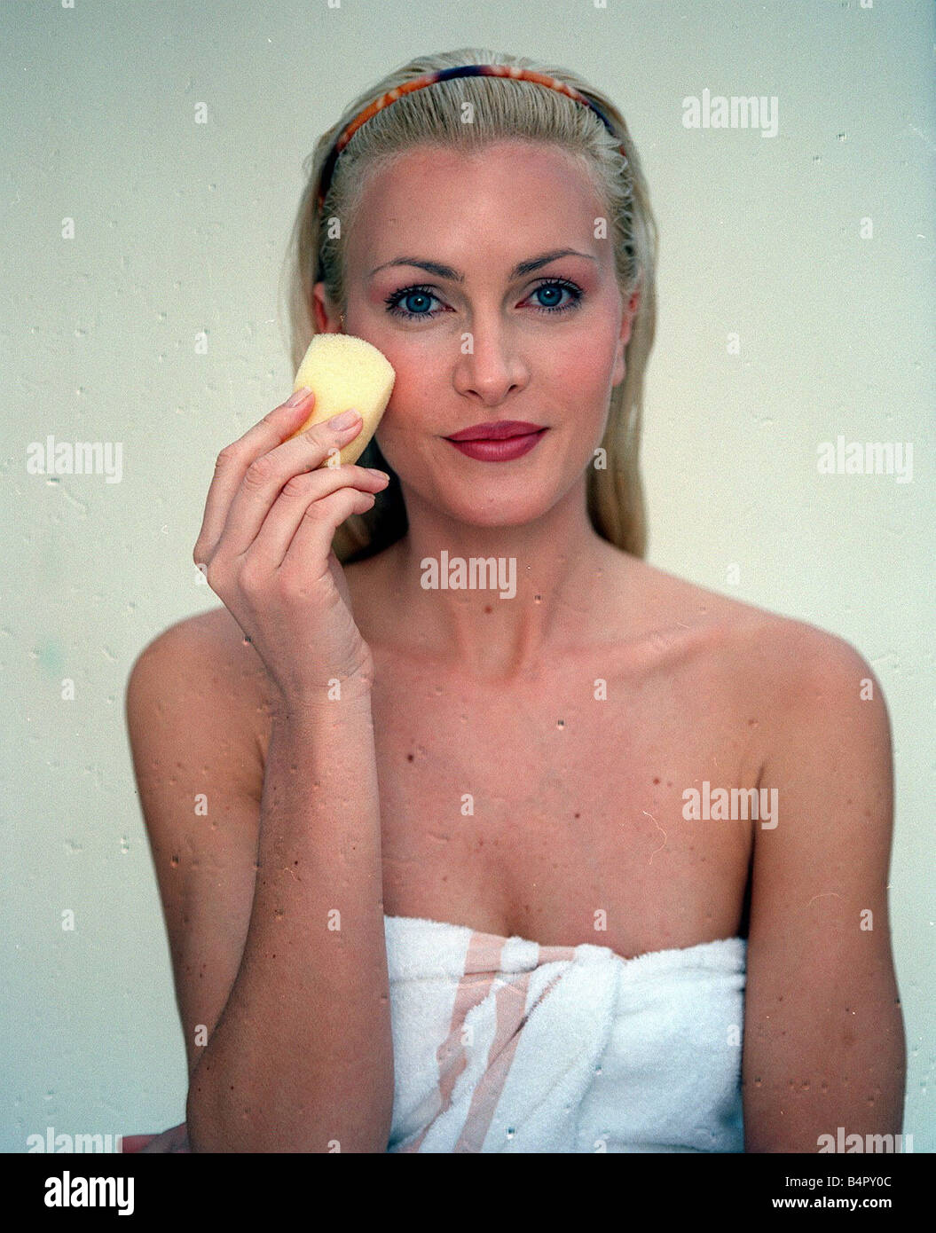 Caprice model with skin care product Beauty regime Beauty products April 1999 Stock Photo